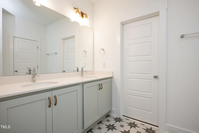 bathroom featuring double vanity, a sink, and tile patterned floors