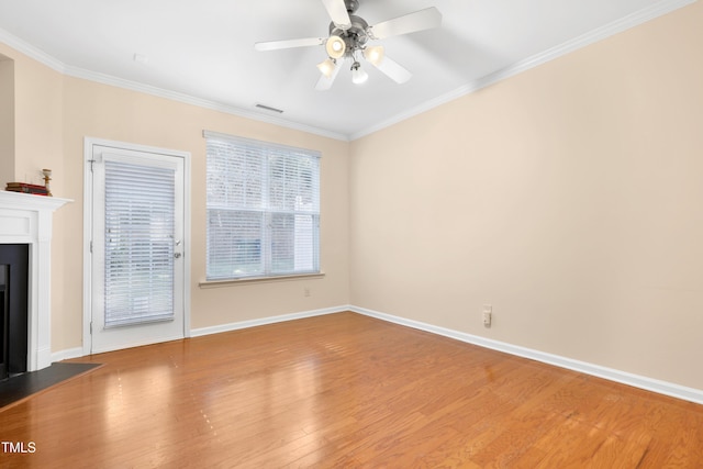 unfurnished living room with hardwood / wood-style flooring, ceiling fan, and crown molding