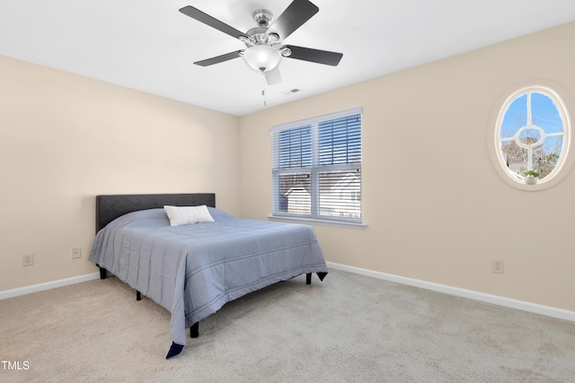 carpeted bedroom featuring ceiling fan