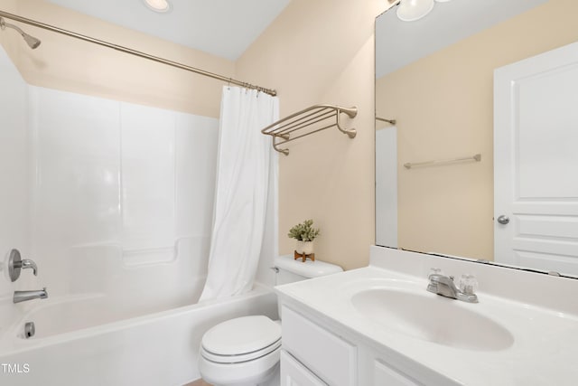 full bathroom featuring vanity, shower / bath combination with curtain, and toilet