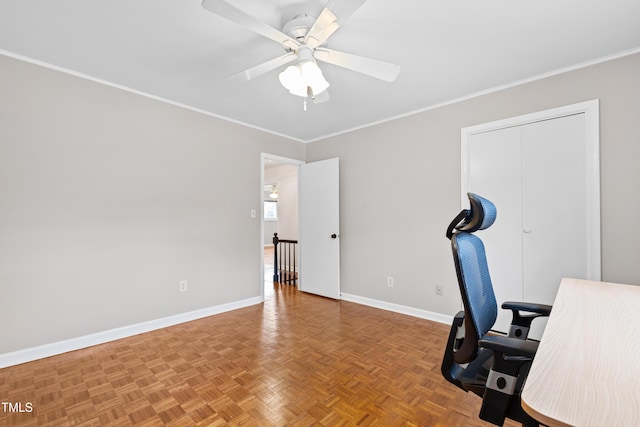 unfurnished office featuring parquet floors, ceiling fan, and crown molding