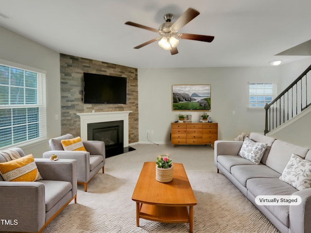 living room with ceiling fan and light colored carpet