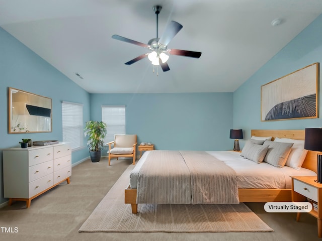 bedroom featuring lofted ceiling, light carpet, and ceiling fan