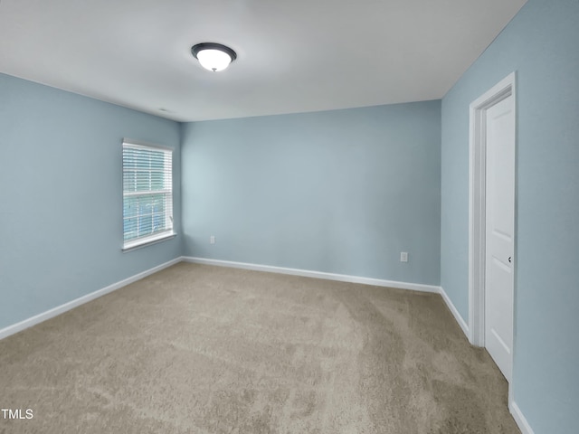 spare room with light carpet