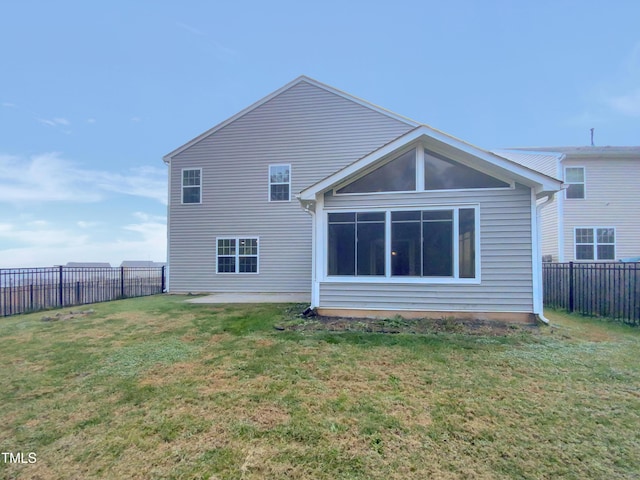 rear view of house with a yard