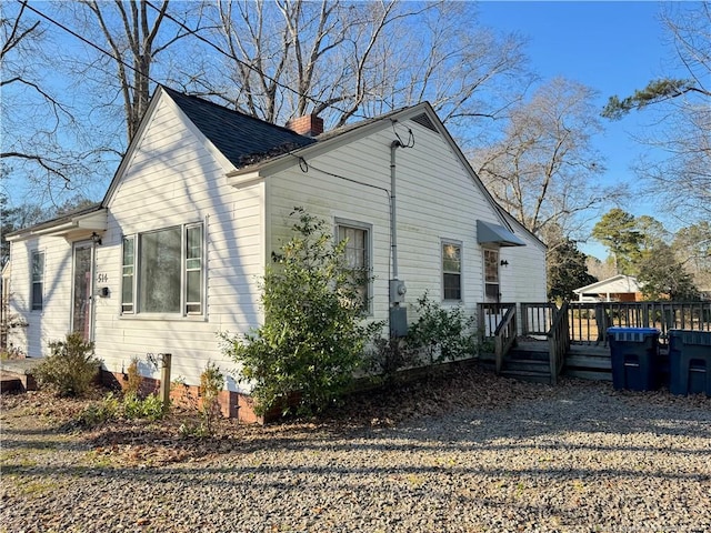 view of side of home featuring a deck