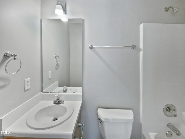 full bathroom with vanity, bathing tub / shower combination, and toilet