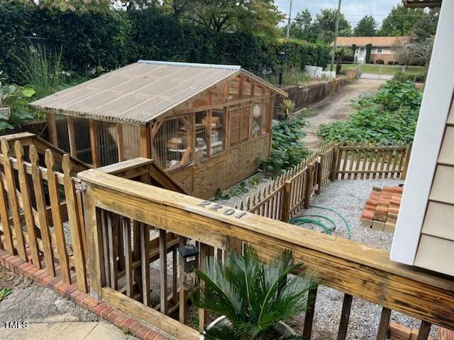 wooden deck featuring an outdoor structure