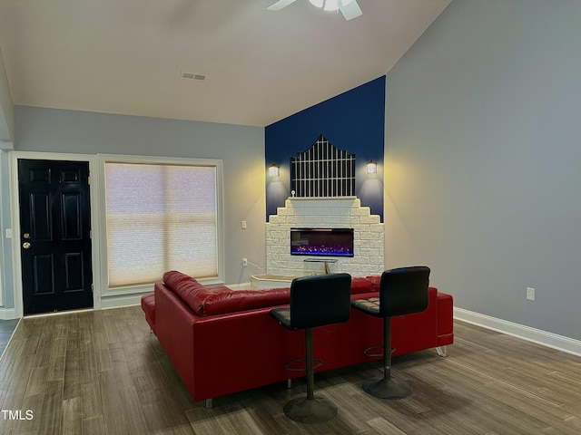 living room with ceiling fan and hardwood / wood-style floors