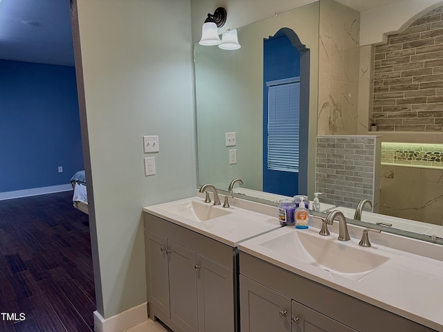 bathroom with vanity and hardwood / wood-style floors