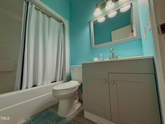 full bathroom featuring vanity, tile patterned floors, toilet, and shower / bath combo with shower curtain