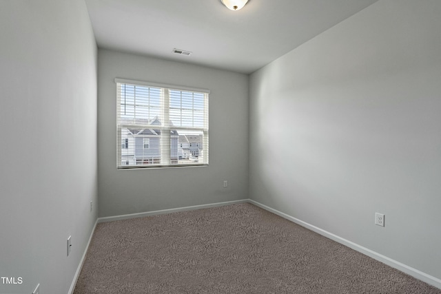 spare room featuring carpet floors