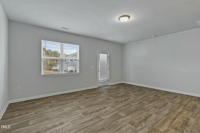 spare room featuring hardwood / wood-style flooring