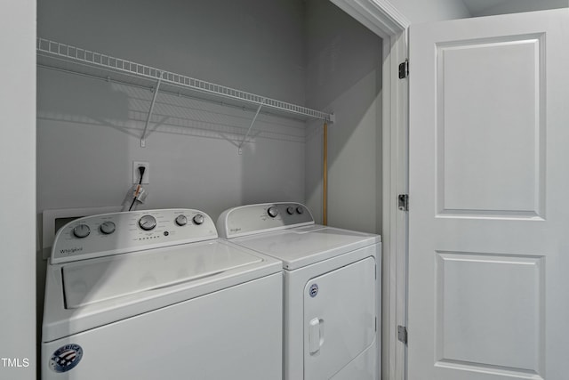 washroom with independent washer and dryer