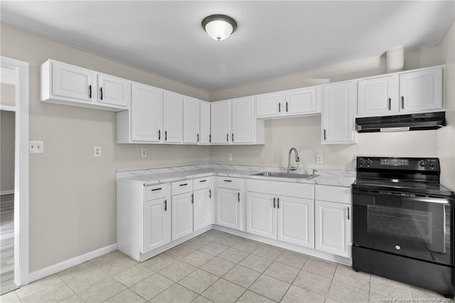 kitchen with black range with electric cooktop, light tile patterned floors, sink, and white cabinets