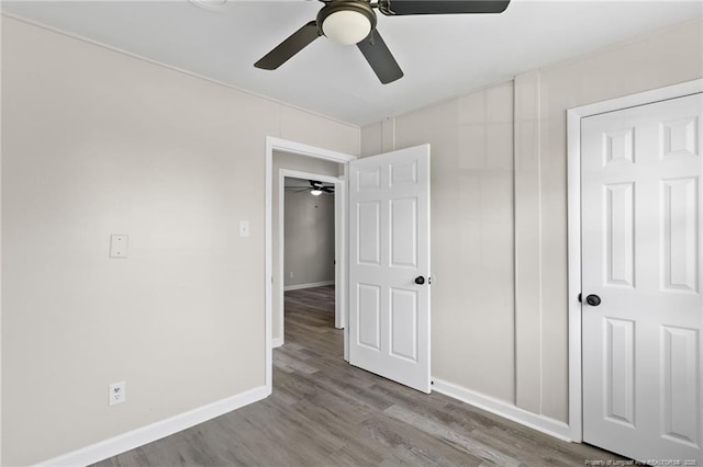 unfurnished bedroom featuring ceiling fan and light hardwood / wood-style floors