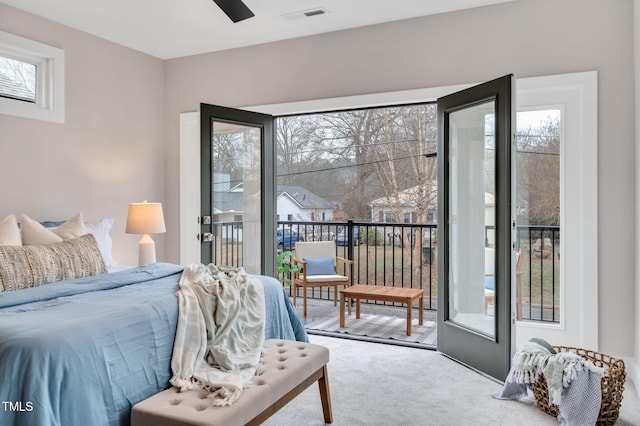 carpeted bedroom with access to outside