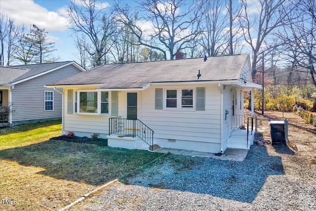 ranch-style house with a front lawn