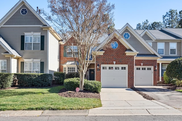 view of front of home featuring a garage, a front yard, brick siding, and driveway