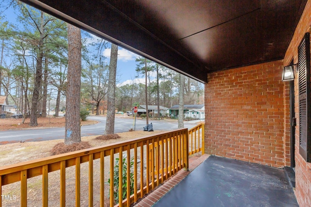 wooden terrace featuring a porch