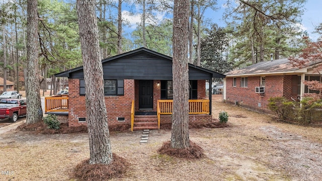 view of front of property with cooling unit and covered porch