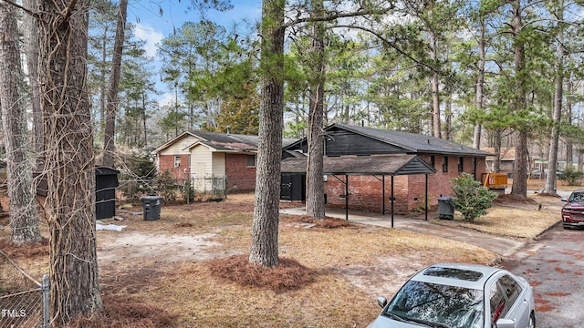 view of front of property featuring a carport