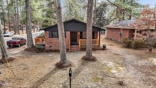 view of front of property with cooling unit and covered porch