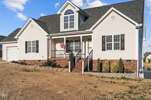 cape cod home with a porch, a garage, and a front yard