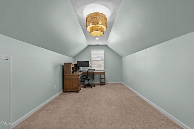 carpeted office with lofted ceiling