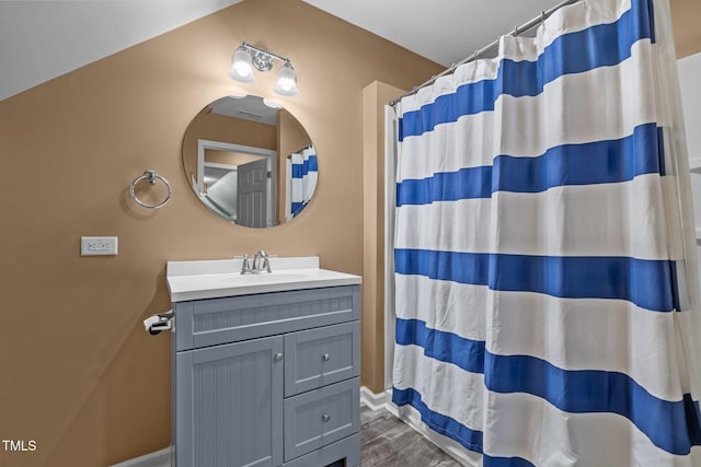 bathroom featuring vanity and a shower with shower curtain