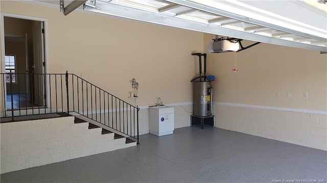 3922 Tasha Dr, Hope Mills, NC 28348 - garage featuring a garage door opener and water heater