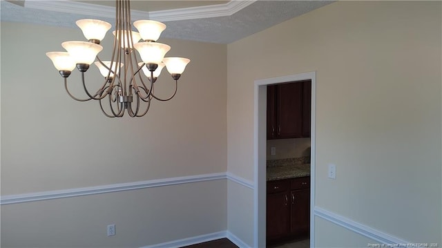 3922 Tasha Dr, Hope Mills, NC 28348 - unfurnished dining area with an inviting chandelier and a textured ceiling