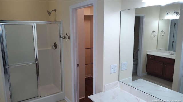 3922 Tasha Dr, Hope Mills, NC 28348 - bathroom featuring vanity and a shower with door