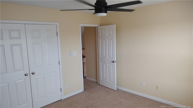 3922 Tasha Dr, Hope Mills, NC 28348 - unfurnished bedroom with light carpet, ceiling fan, and a closet