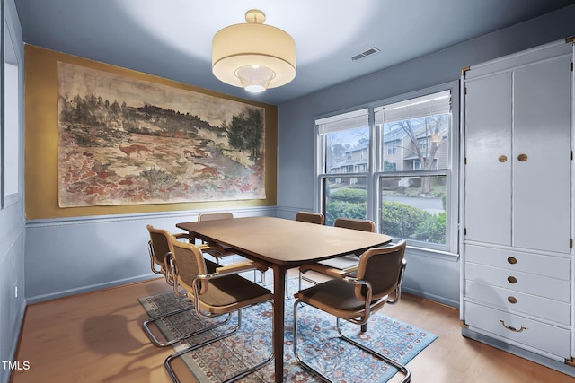 dining area with light hardwood / wood-style floors