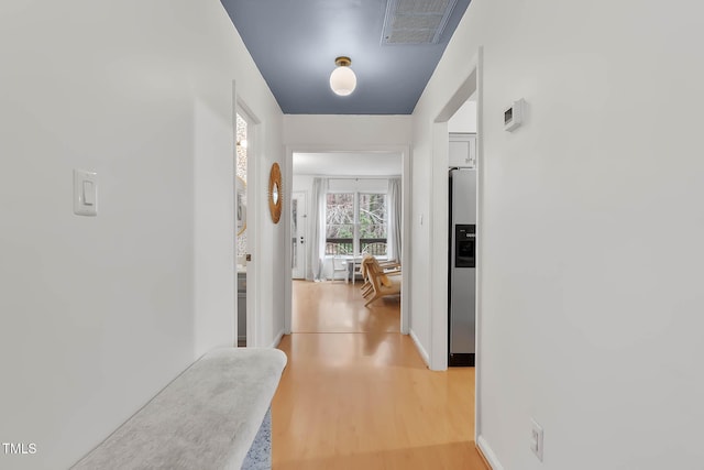 hallway featuring light hardwood / wood-style flooring