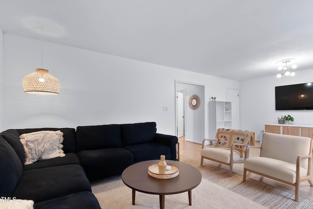 living room with a notable chandelier