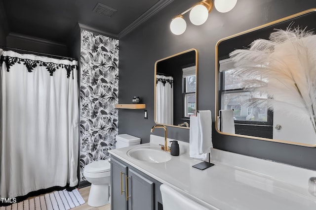 bathroom featuring ornamental molding, toilet, and vanity