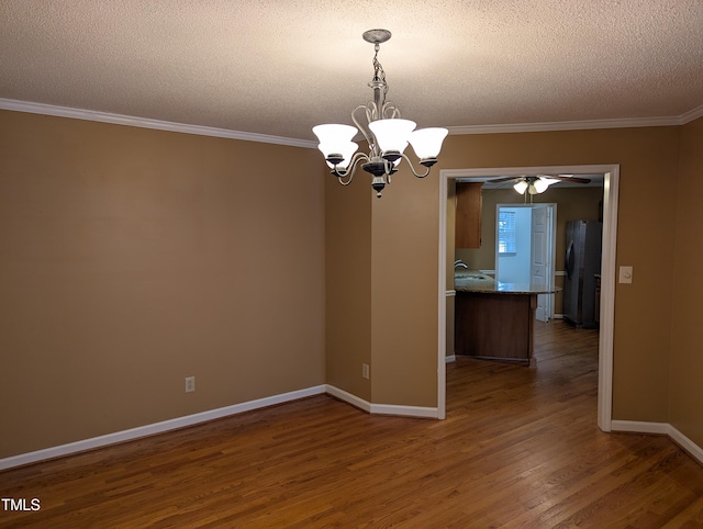 unfurnished room featuring ornamental molding, dark wood-type flooring, ceiling fan with notable chandelier, and a textured ceiling