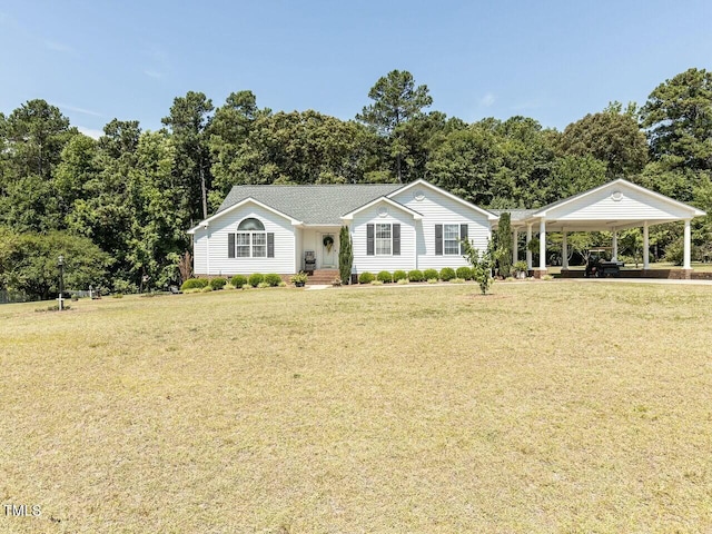 view of front of house with a carport and a front yard