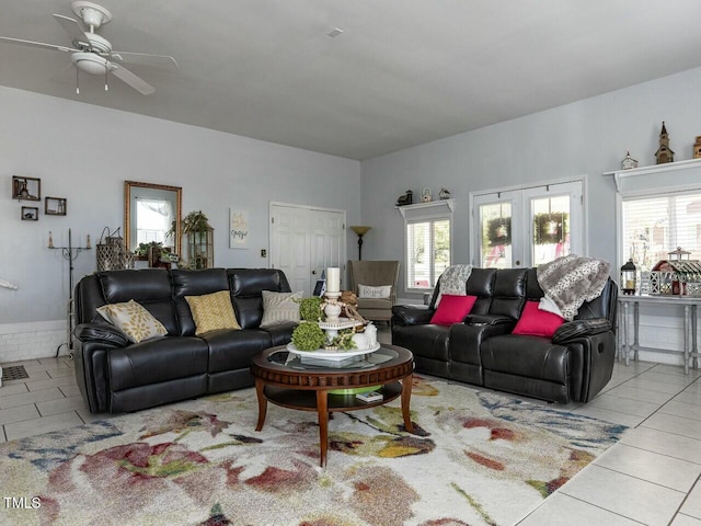 tiled living area with a ceiling fan