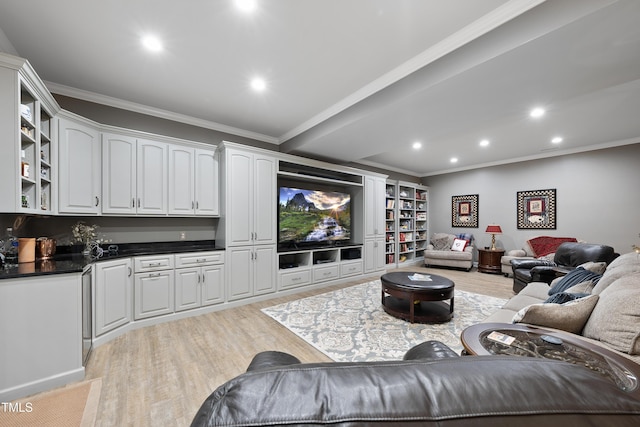 living room with ornamental molding and light hardwood / wood-style floors