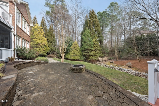 view of patio with a fire pit