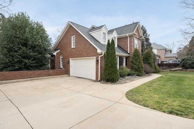 view of side of home featuring a yard and a garage