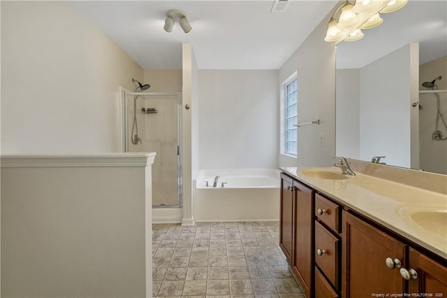 323 River Oak St, Spring Lake, NC 28390 - full bath featuring double vanity, a garden tub, a stall shower, a sink, and baseboards