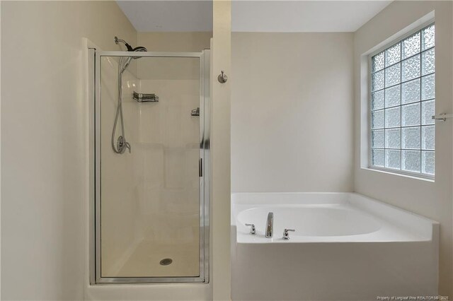 323 River Oak St, Spring Lake, NC 28390 - bathroom with a stall shower and a bath