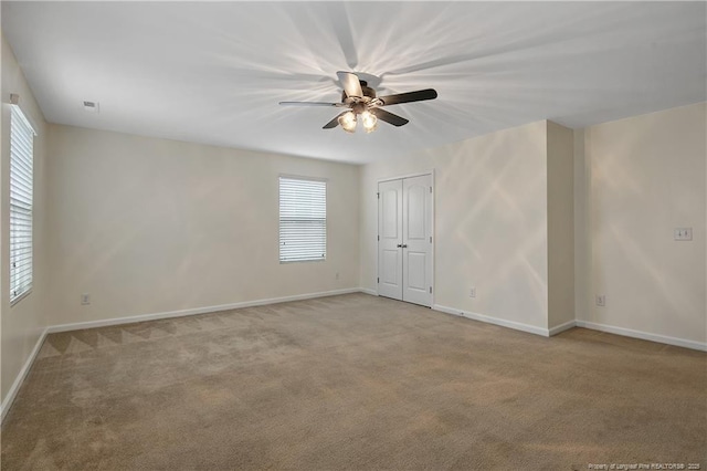 323 River Oak St, Spring Lake, NC 28390 - spare room with light carpet, a ceiling fan, and a healthy amount of sunlight