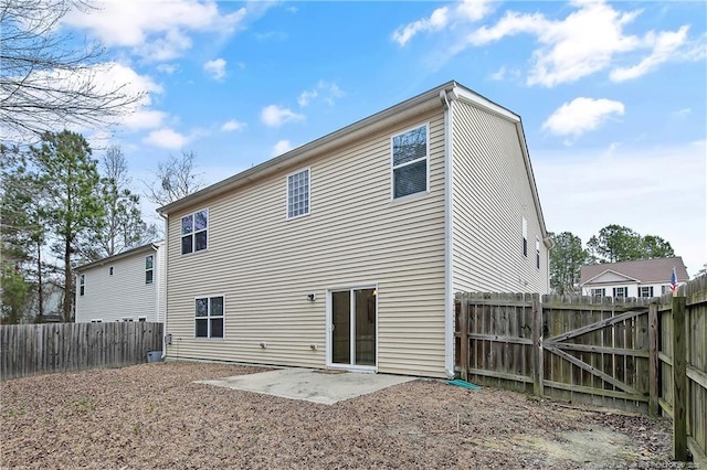 323 River Oak St, Spring Lake, NC 28390 - back of property with a patio area and a fenced backyard