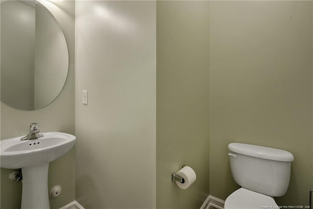 323 River Oak St, Spring Lake, NC 28390 - bathroom featuring toilet and baseboards