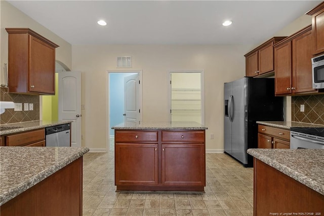 323 River Oak St, Spring Lake, NC 28390 - kitchen with decorative backsplash, baseboards, visible vents, and appliances with stainless steel finishes
